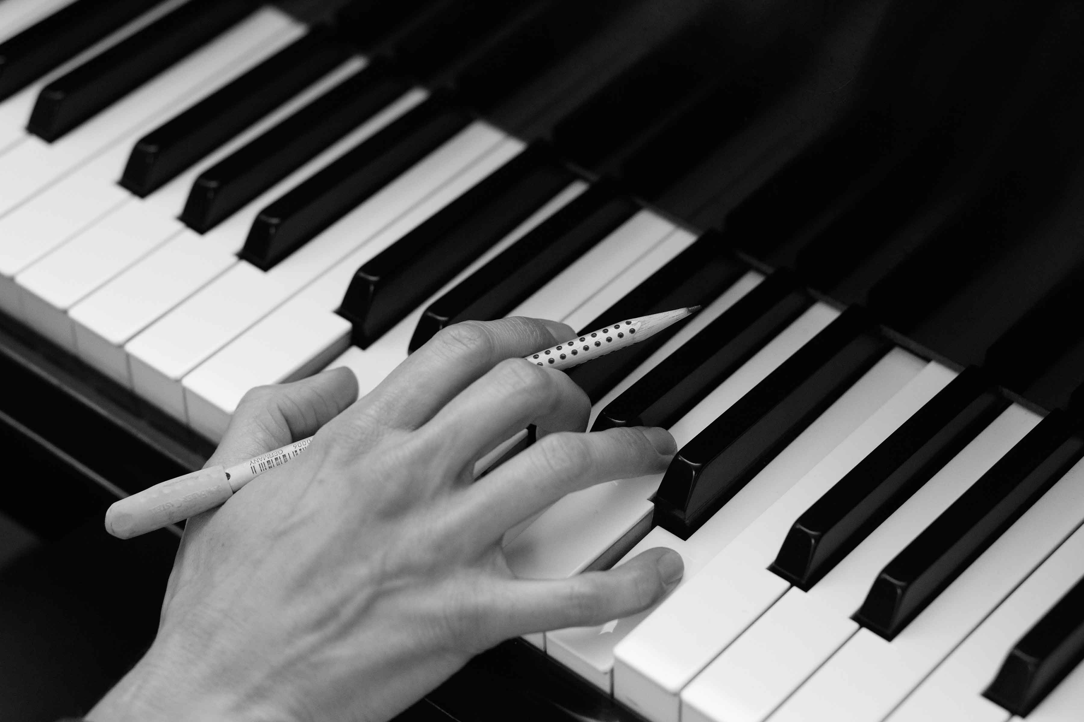 Eva composing at the piano